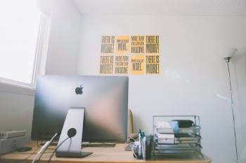 iMac Pro workstation with Ephesians 3:20 posters hanging in the background!
