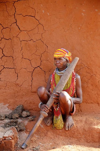 Indigenous Person Holding a Wooden Stick
