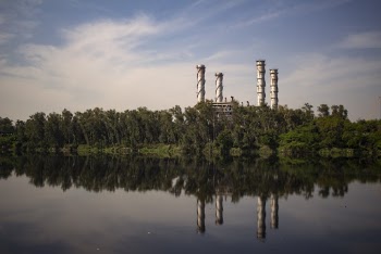 Industrial Plant With Reflection Om Body Of Water