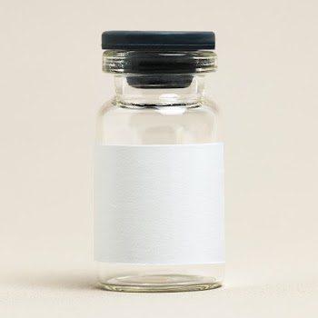 Injection glass bottle with blank white label