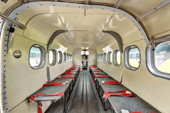 Inside view of seating for parachuting twin engine turbo prop looking forward