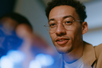 Inspired Young Hispanic Man in Modern Office