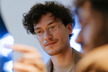 Inspiring Young Hispanic Professional in Modern Office