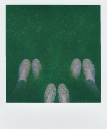 Instant Photography Of A Person's Footwear