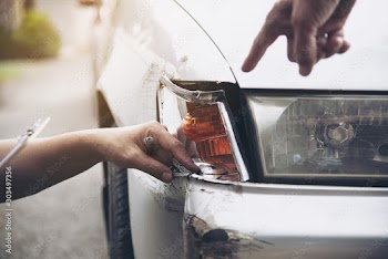 Insurance agent working during on site car accident claim process - people and car insurance claim concept