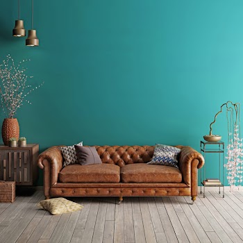 Interior in classic style with soft sofa and lamps with decor. Wall for mock up. 3d render.