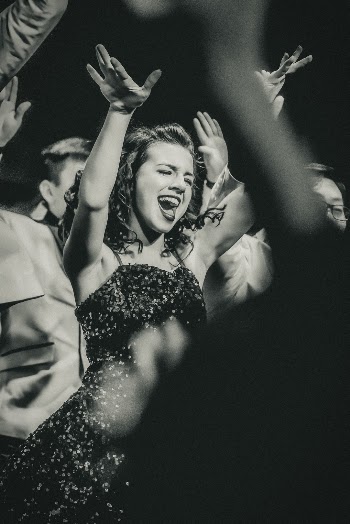 (Internation Women’s Day) This young lady was all in for her high school show choir event.  I love the energy and the willingness to just throw herself into the performance 100%.  
The show lights ended up giving this a 1940’s newspaper vibe - which I totally loved and thought made a perfect fit.