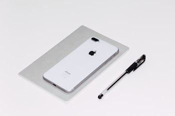 iPhone 8 Plus and a notebook