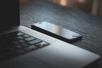 Iphone Beside Laptop Computer