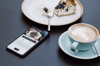 iPhone X on the table in a café
