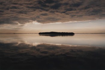 island in the middle of body of water