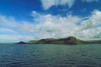 island under blue sky