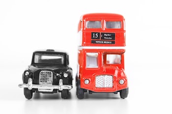 Isolated models of red London Bus and black taxi
