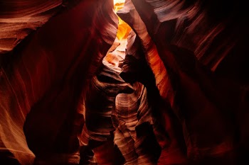 It has been photographed a billion times, but I always find something that interests me. This trip was no different. I tried shooting up into the crevasse above to capture the subtle ways light would play down the edges and smooth sides of the polished sandstone.