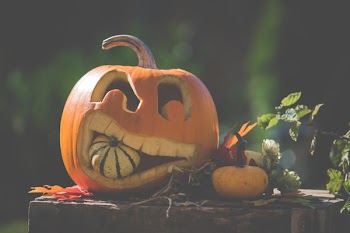 Jack O' Lantern On Top Of Wooden Surface