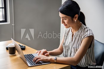 Japanese woman working on a laptop