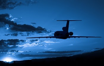 Jet Airplane flying to sunrise