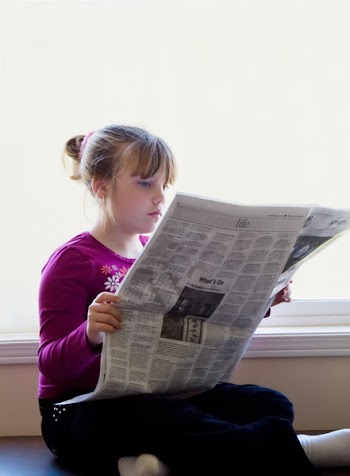 JGS_GirlReadingNewspaper_02.jpg