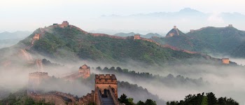 Jinshanling Great Wall runs up and down among the mountains where...