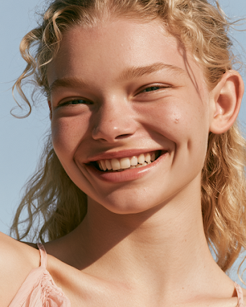Joyful Blonde Woman in Summer Portrait