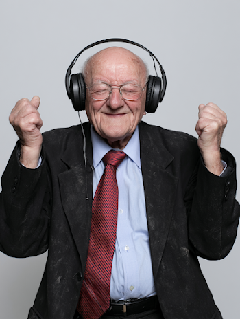 Joyful Elderly Man Enjoying Music