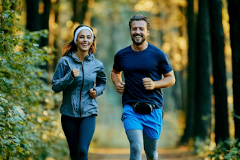 Joyful Runners Jogging on Forest Trail