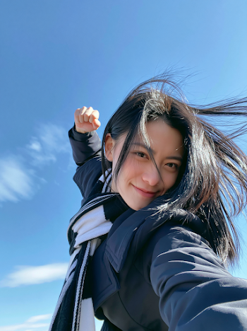 Joyful Selfie of Young Woman Outdoors