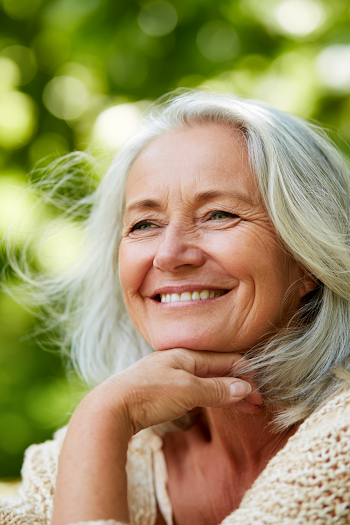 Joyful Senior Woman in Sunlit Park