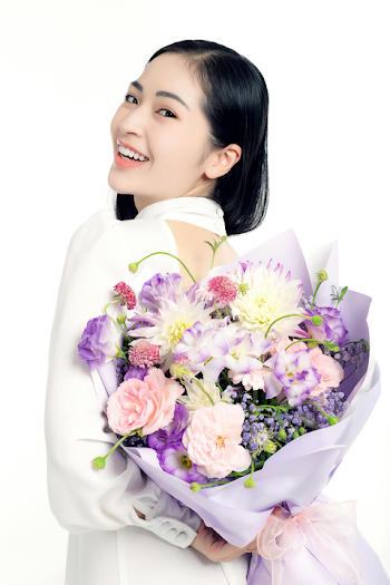 Joyful Woman with a Floral Bouquet