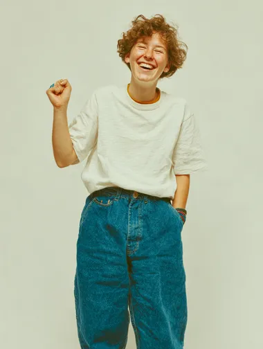 Joyful Young Woman in Casual Attire Joyful Young Woman in Casual Attire