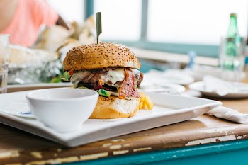 Juicy burger in a vibrant interior 