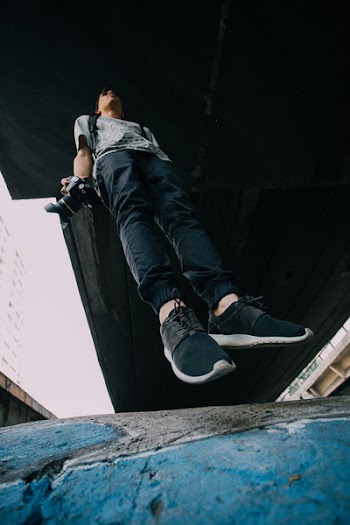 Jumping Man Wearing Black-and-white Shoes