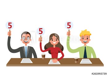 Jury sitting at the desk and showing scorecards