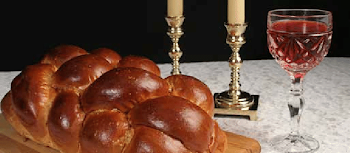 Kabbalat Shabbat table: candles in candle holders, challah and a ...