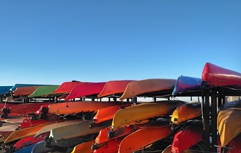 Kayaks On Racks Under Blue Sky.Jpeg