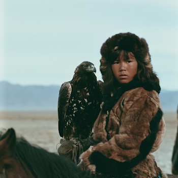 Kazakh Huntress with Eagle on Horseback