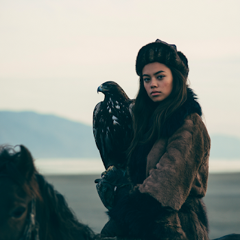 Kazakh Huntress with Golden Eagle on Horseback