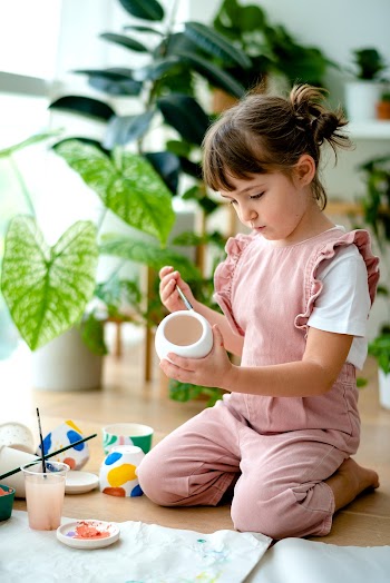 Kid DIY pot painting hobby at home | Free stock photo | High Resolution image