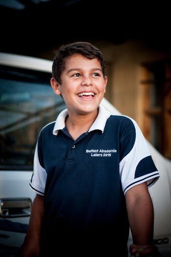 Kid Wearing Blue and White Polo Shirt