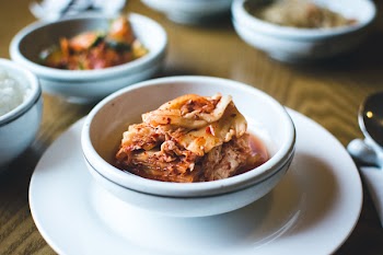 Kimchi in a white bowl close up 