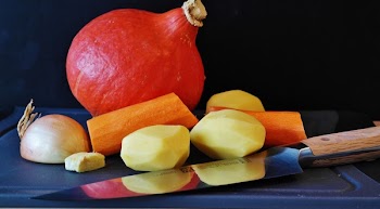 Kitchen Knife With Peeled Sweet Potato and Sliced Garkuc