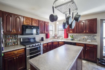 Kitchen With Kitchen Island Table Oven and Drawers