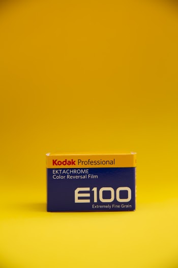 Kodak E100 Professional Ektachrome Color Reversal Film Box on Yellow Surface