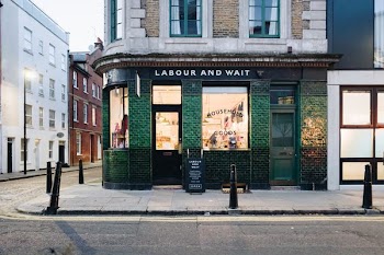 Labour And Wait green concrete storefront