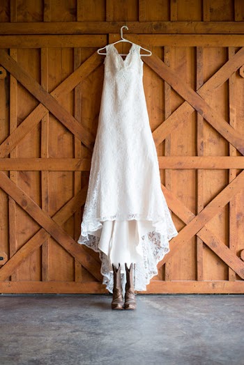 Lace Dress Hanging On Brown Wall