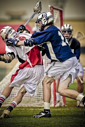 Lacross Player Battling on the Field