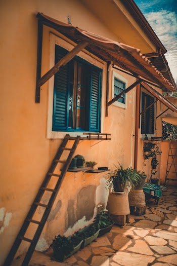 Ladder Leaning Near Window