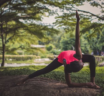 Lady in Pink Tank Top Doing a Yoga Pose