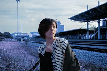 Lady in White Pinstripe Scoop-neck Shirt and Black Jacket