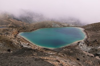 lake in the middle of mountain